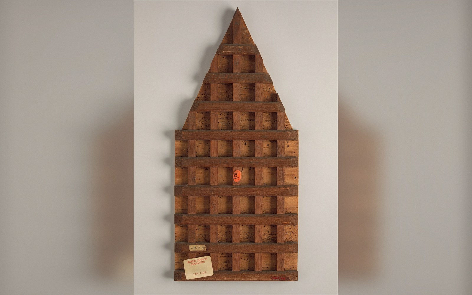 The reverse of a wooden panel showing battens and joins